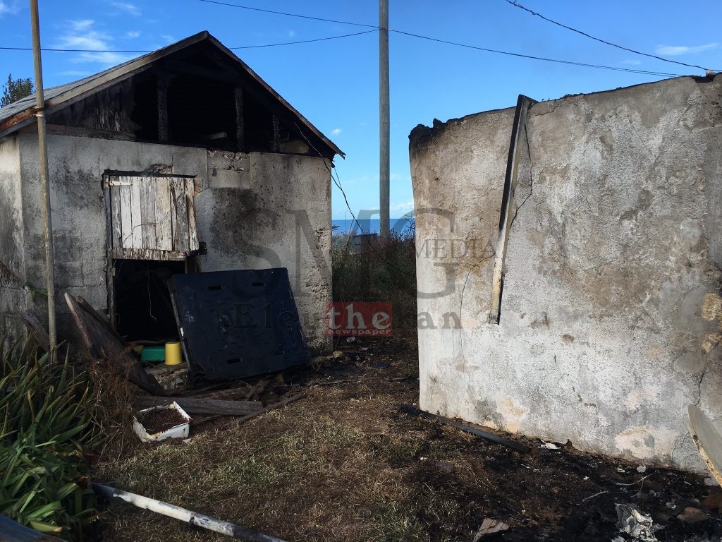 Smaller damaged building adjacent to Mr. Bethel's home.