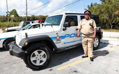 Supt. Wright standing next to one of three new Jeeps