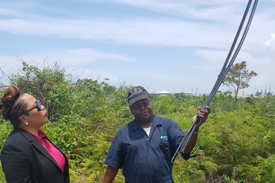 BTC Northern VP Eldri Ferguson Mackey surveys the damage along with Adrian Allen of field services following the discovery of copper cable theft in the Lewis Yard area. (Photo Courtesy of BTC for Barefoot Marketing)