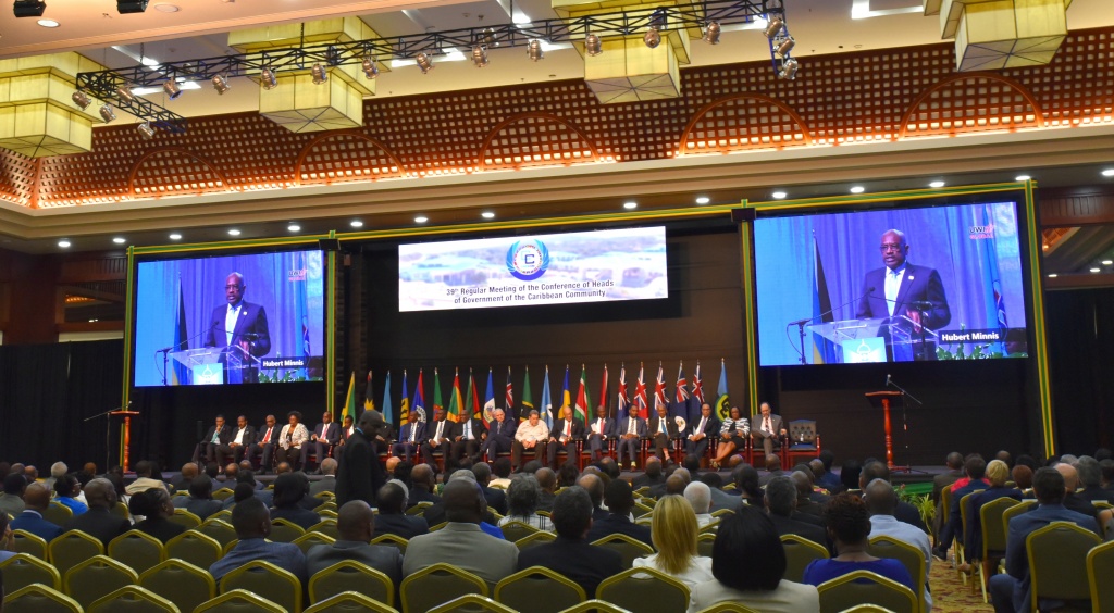 CARICOM opening session -- Prime Minister of The Bahamas, Dr. the Hon. Hubert Minnis shown during a presentation, on large screens.
