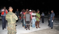 Haitian migrants after they were brought into the capital early Wednesday morning.