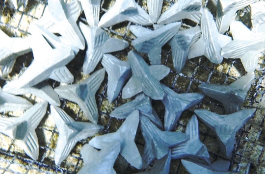 Home-made substrates used to induce baby coral settlement. The tetrahedron shape allows these substrates to be easily wedged onto a reef during out-planting. 