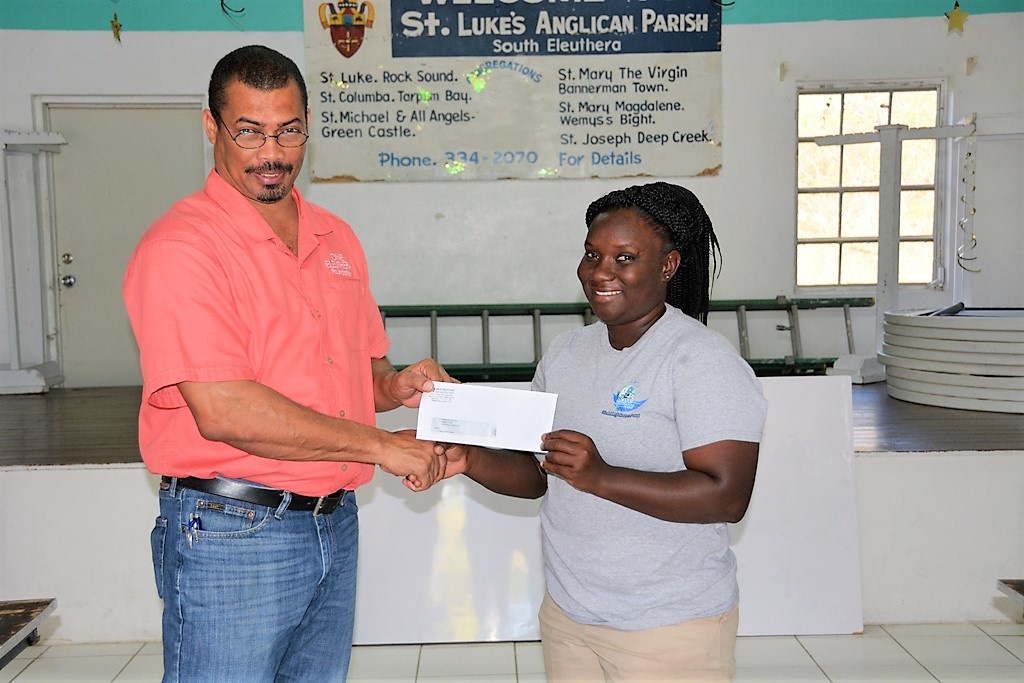 3rd place winner, Breandra Whylly receiving her prize check from OEF CEO Shaun Ingraham.