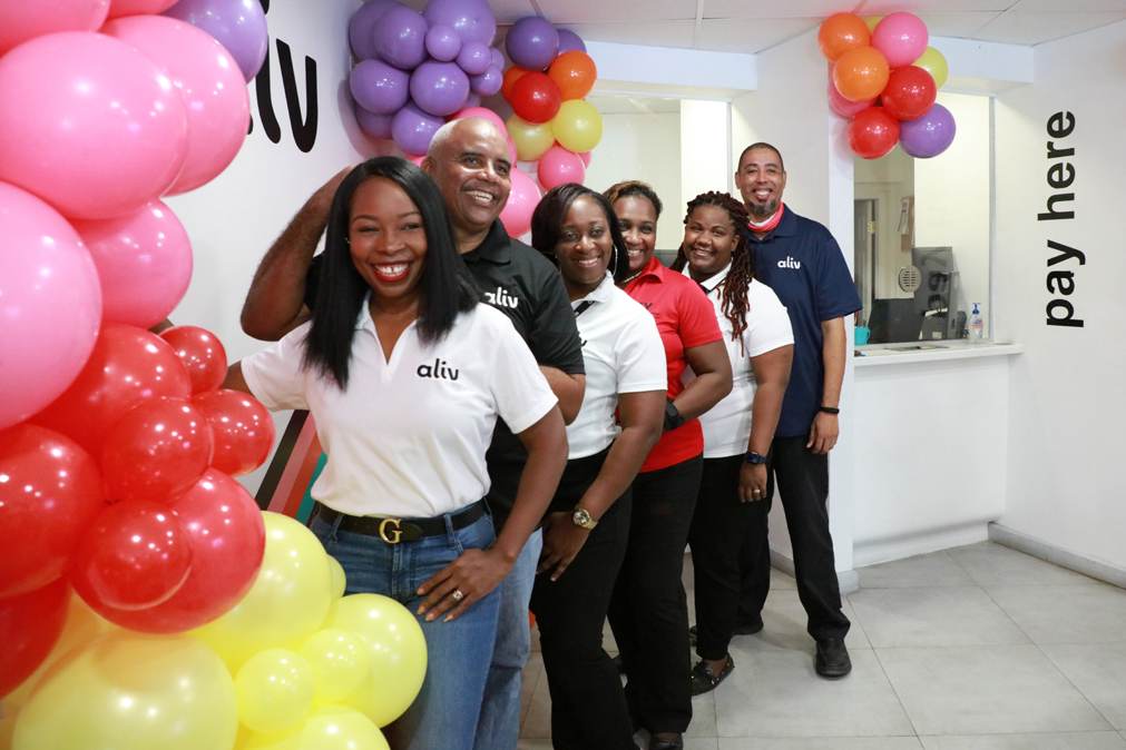 ALIV Governor's Harbour store team members all smiles as they celebrate 5 years in business.