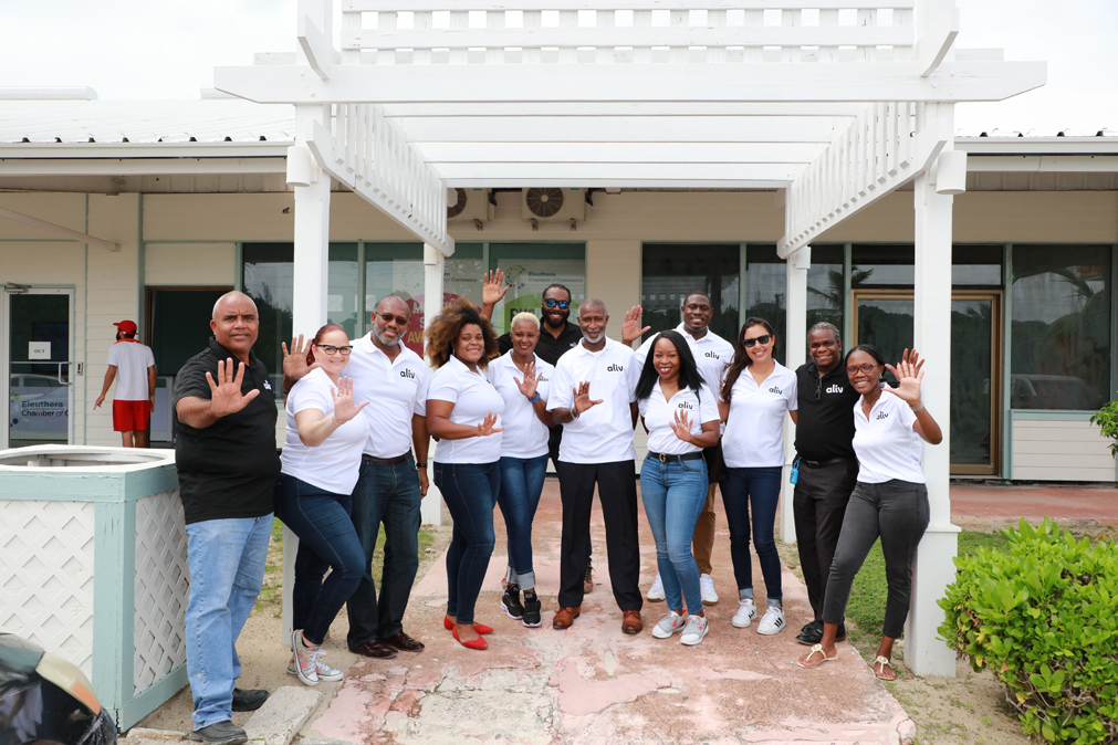 ALIV CEO John Gomez (center) stands with his ALIV team in front of the Eleuthera Business Hub, located in Rock Sound, South Eleuthera.