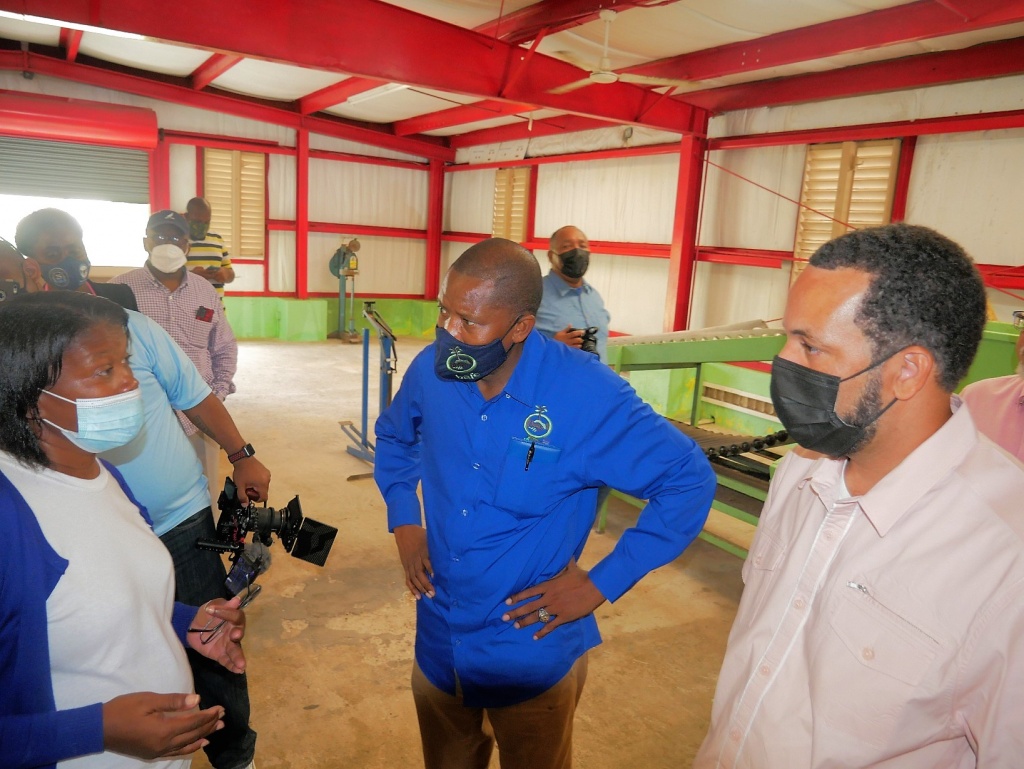 Executive Chairman of Bahamas Agricultural and Industrial Corporation (BAIC) Leroy Major and Bahamas Agricultural and Marine Science Institute (BAMSI) Executive Chairman Senator the Hon. Tyrel Young speak with employees at the Packing House in Green Castle, Eleuthera. 