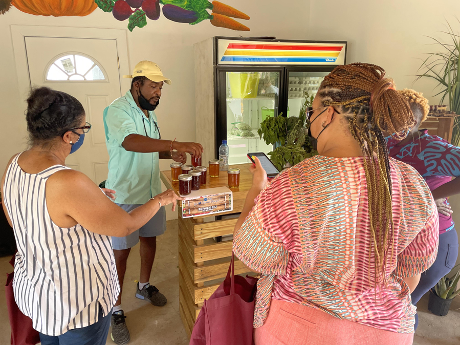 Deon Gibson, Agricultural Manager at CTI a.k.a “Gibby Da’ Farma” showcases the delicious golden honey harvested from CTI’s very own on-site beehives.