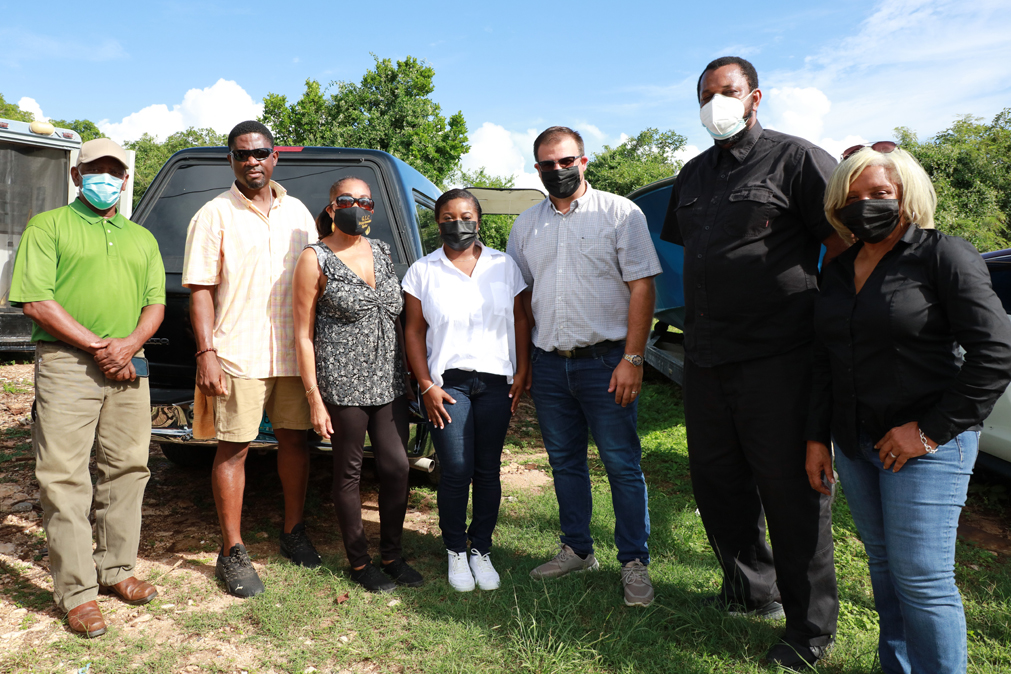 Minister of Housing with MP Sweeting and entourage in Governor's Harbour.