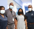 Above: Dr. Arlington Lightbourne (center left) stands with members of his medical services team at the Bahamas Wellness Eleuthera Medical Center.