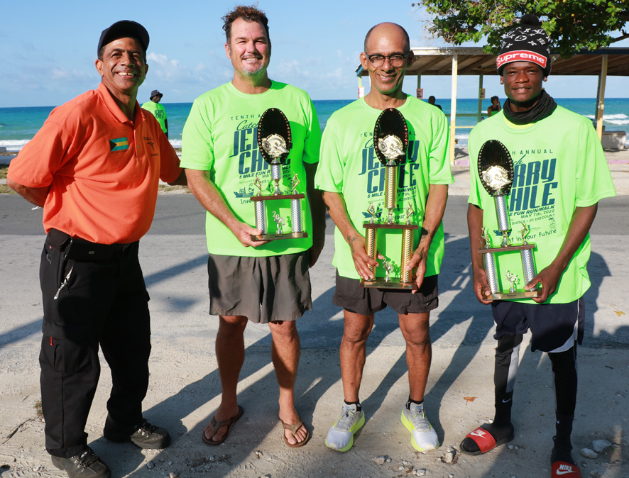 Runner division top three finishers, standing with Jason Thompson of HACE (far left). L-R: Jason Thompson, Tom Glucksmann, Miska Clarke, and Steven Dany.