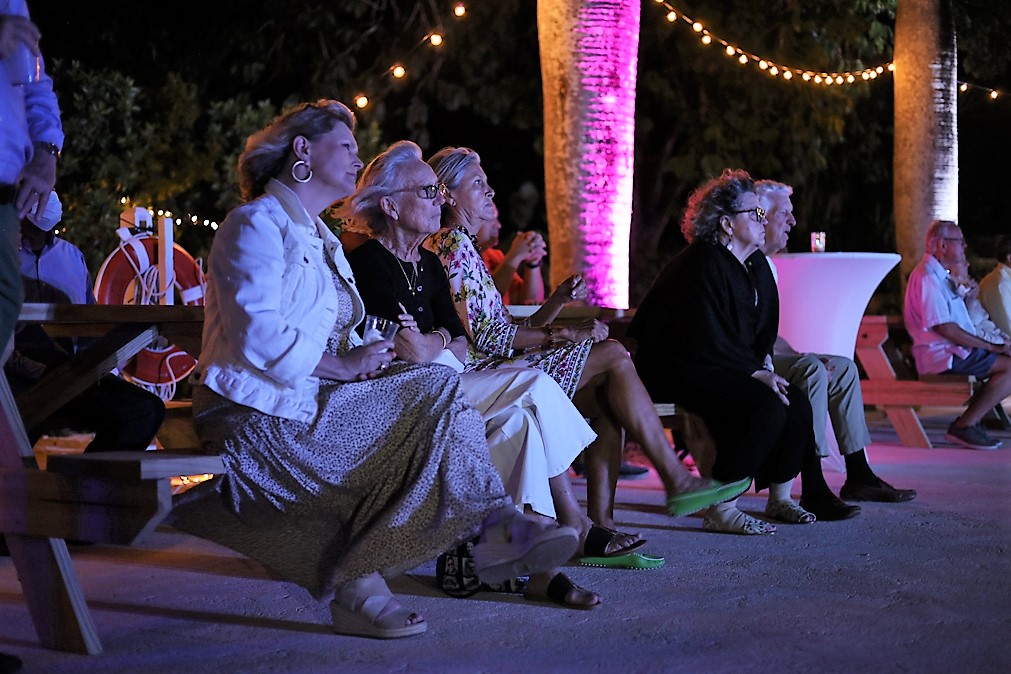 Friends and partners of the organization watch a captivating video highlighting OEF’s “Journey of a Vision.”