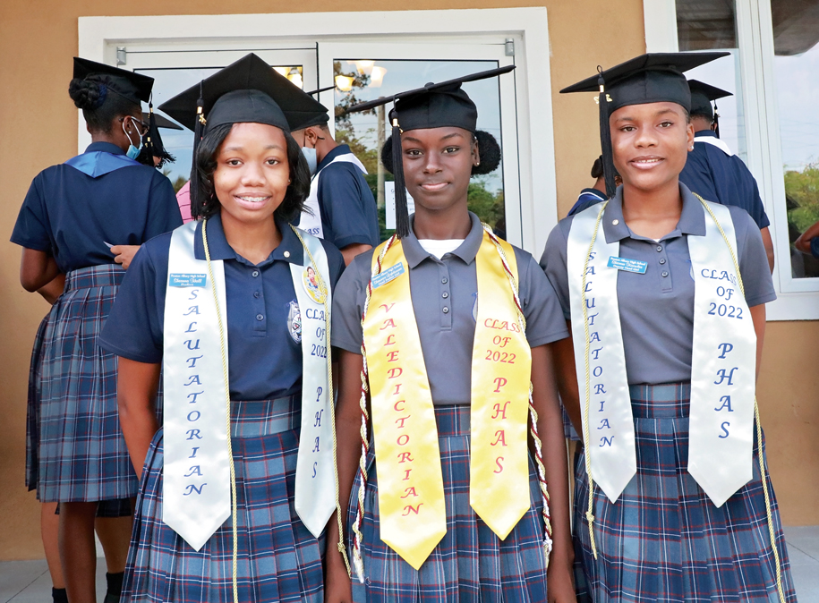 Above (L-R): Sheanna Hall (co-Salutatorian), Shawnice Lightbourne (Valedictorian), and Shicara Knowles (co-Salutatorian) smile proudly as the top performers of their graduating class at Preston H. Albury High School.