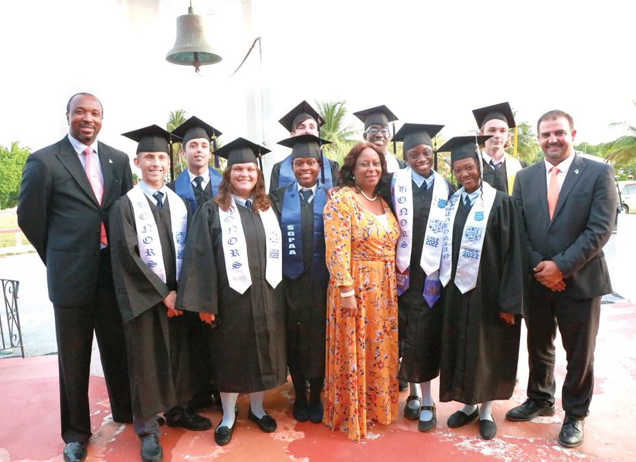 Samuel Guy Pinder All Age School's Class of 2022 standing with District Superintendent of Education, Mr. Michael Culmer (far left), their Principal, Mrs. Navidia Mills (center), and Minister Clay Sweeting (far right).