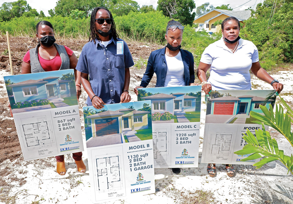 Local volunteers assist with showcasing the four models of homes on display by the Ministry of Transport and Housing, as building choices within the new Ocean Hole subdivision.