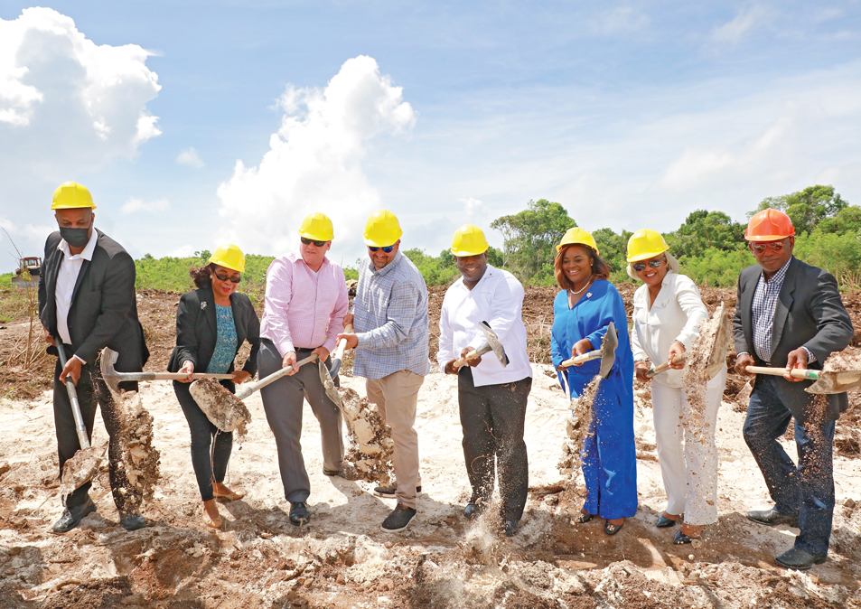 PM Davis first to break ground as he stands with Housing Minister Jobeth Coleby-Davis, Central and South Eleuthera MP Minister Clay Sweeting, Senator and Attorney General Ryan Pinder and other ministry officials at the site of the new Ocean Hole Subdivision in Rock Sound, South Eleuthera.