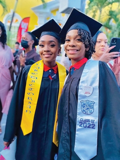 Top of their Class of 2022 at the Harbour Island All Age School, Valedictorian - Aloa Higgs (left), and Salutatorian - Amelia Grant (right) take a moment together during the celebration of commencement on Tuesday, June 14th, at the Methodist Church in Harbour Island.