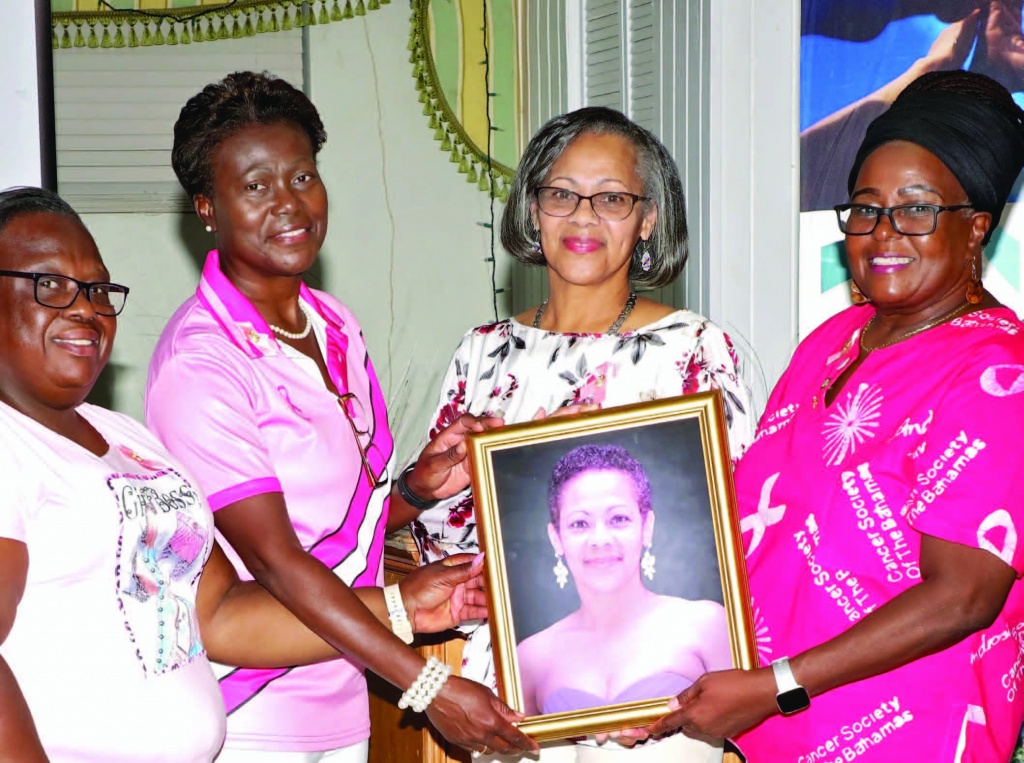 New Eleuthera Cancer Society (ECS) president, Ms. Susan Culmer, presented with her portrait by fellow board members. The portrait will be hung within the Cancer Society's Wellness Center in Palmetto Point, alongside the four previous presidents since the 1985 founding of the organization.