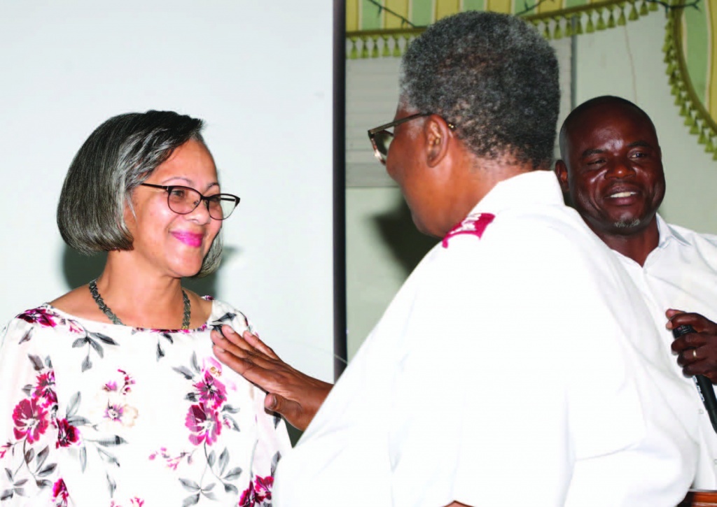 Above: Local Salvation Army leader, Major Hepburn, invited as quiest speaker for the September 10th ECS board installation, is pictured pinning new president, Ms. Susan Culmer.