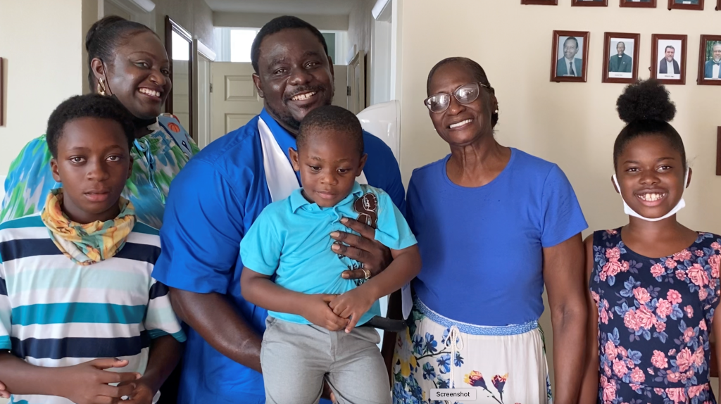 Pictured above: Carpentry graduate Tavashio Stubbs beams with pride surrounded by his proud cheering squad, including his wife, children and mother-in-law.