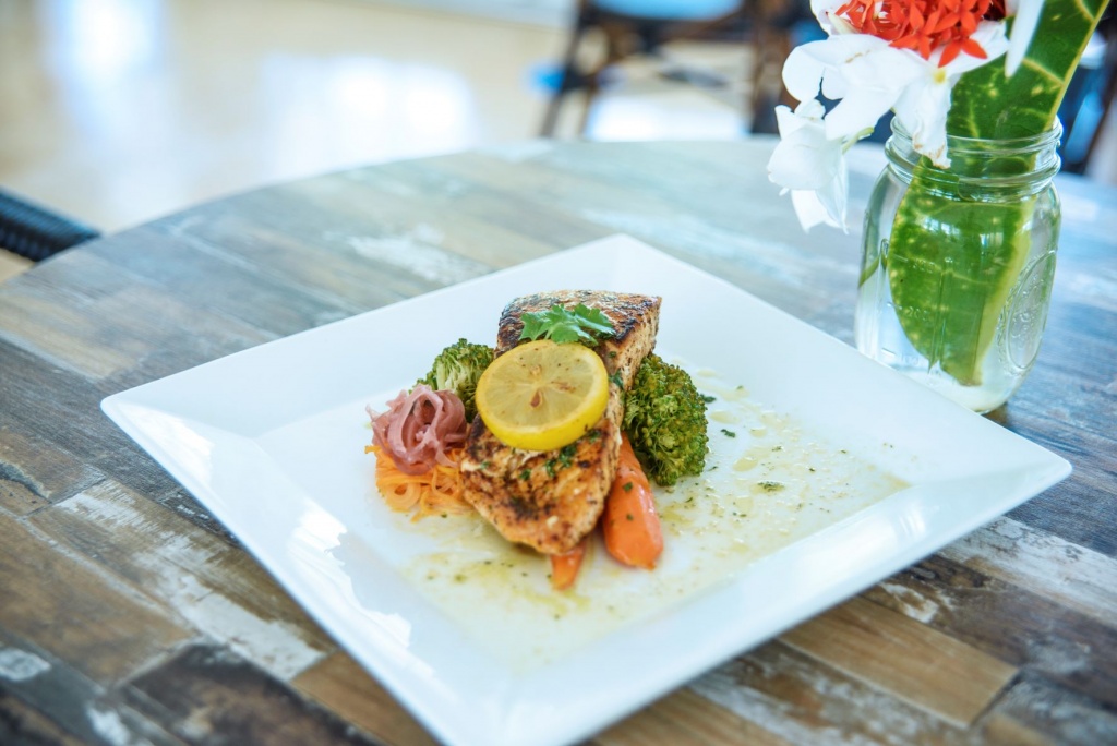 A light bite: Grilled Salmon in an herb-butter sauce with seasoned veggies. 