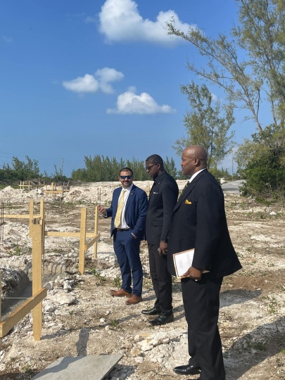 CSE MP the Hon. Clay Sweeting stands with the Hon. Zane Lightbourne and Hon. Vaughn P. Miller, as they view the start of construction on homes within the Ministry of Housing and Transport's new Ocean Hole Subdivision in Rock Sound, South Eleuthera, early in December 2022.