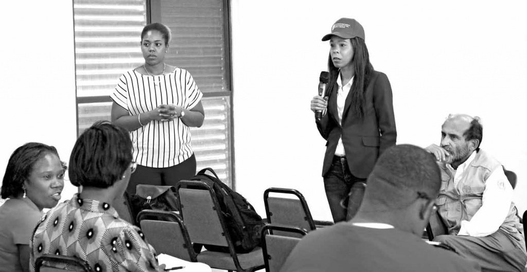 Kentisha Ward, Project Coordinator with the FAO's Digital Villages Initiative, presenting the concepts along with Jeri Kelly, FAO National Correspondent, and Dr. Crispin Moreira, FAO Country Representative.