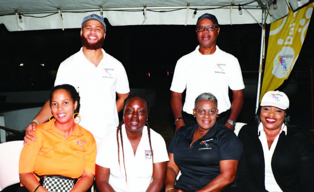 Seated - Ministry of Tourism officials (L-R) - Samantha Fox, Karen Rolle, Doria Forbes, and Bernadette Richards, with the General Manager for Eleuthera, Harbour Island and Abaco, Mr. Prescott Young (back right standing).