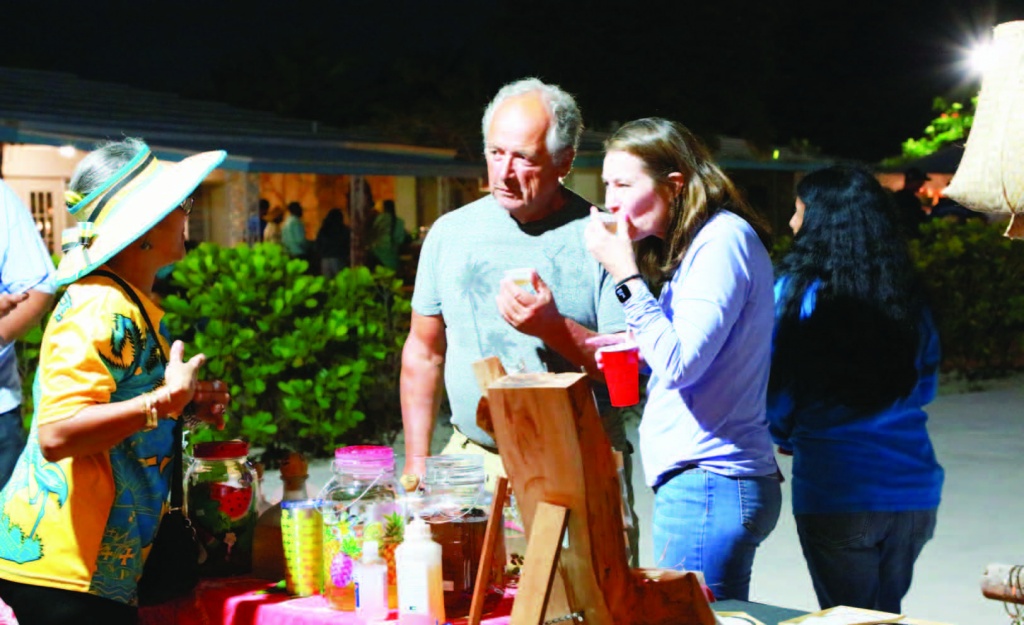 Visitors sampling a tasty variety of 'bush teas' offered up Ms. Susan Culmer.