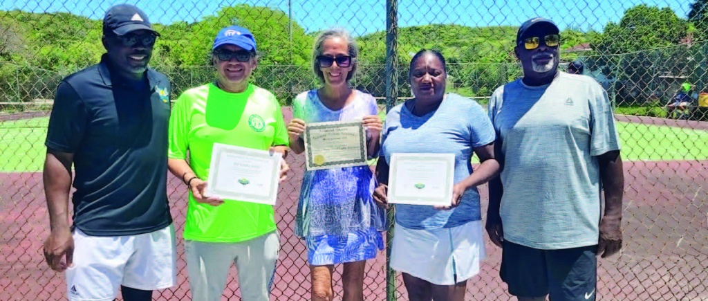 Above (L-R): BLTA president Perry Newton, Roy Rivera, Carol Young, Michelle Walker, and Coach 'Artie Johnson'. Rivera and Walker receive 'Play Tennis' certifications, and Young receives her USTA coaching certificate.