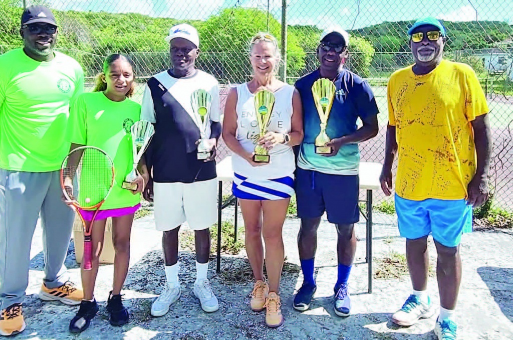 Mixed Double Winners, Van Wilson and Tracie Penfound and runners up, Larry Rolle and Caitlin Walker, stand with Coach Artie Johnson, ETA president and tournament director (right).