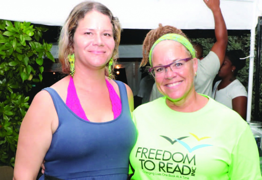 Kelly Sweeting with Susy Siel, all smiles at their tropical mixed drinks booth (CocoJo).