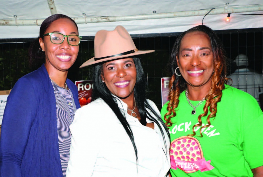Above: Lashonda Leary (on right), owner of the Rock Oven, was assisted in her booth, specializing in delicious pizzas on Saturday, by Lashelle Ingraham of First Ministry (on left), and her sister, Stacy Ferguson, owner of True Serenity Hair Salon in Rock Sound (center).