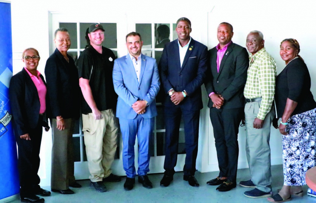 MP Central and South Eleuthera, Clay Sweeting (4th from left), is pictured with several attendees of the Business Outlook, inclusive of representatives of the Ministry of Education, Bahamas Technical and Vocational Institute as well as Disney Cruise Line.