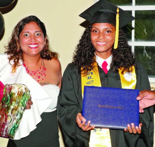 Layla Isaacs, Valedictorian at North Eleuthera High School, stands with her very proud Mom after being presented with her diploma and awards