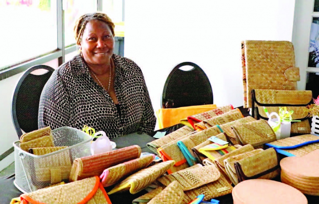 Andrea Johnson-Carey, former education administrator displaying her creative straw work designs during the Eleuthera Expo.