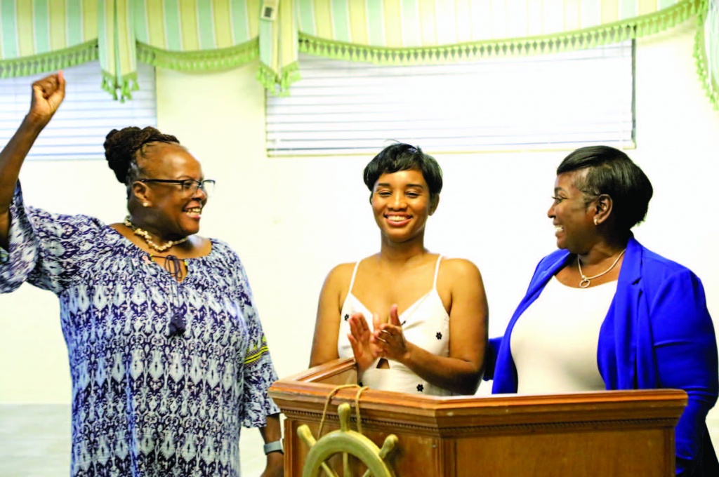 Bahamas Wellness Medical Director Dr. jessica Moss, makes the mammogram machine announcement as Cancer Society Executive Jacquelyn Gibson and New Central Eleuthera Island Administrator Rochelle anderson, look on at CSE's Mix n' Mingle event in mid-September.