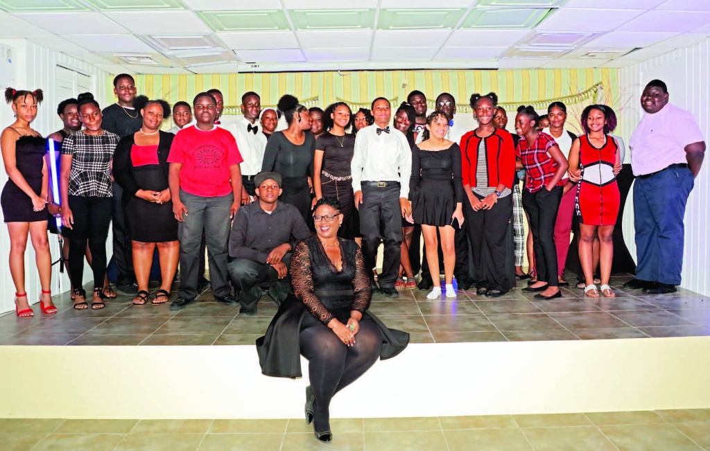 Sophia Sturrup-Smith, English Language, Literature and Performing Arts teacher at Central Eleuthera High School is shown with her young proteges - all of whom are either members of the Performing Arts club at the school, or part of a Performing Arts class.