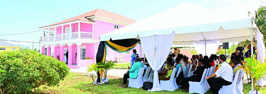  Crowd gathered on the picturesque grounds of the renovated administrator’s residence site for the rededication ceremony.