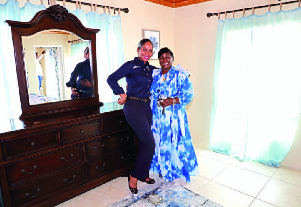 Administrator Rochelle Anderson stands with Deputy Chief Councillor Central Eleuthera, Phillipa Kelly in the guest room of the renovated and rededicated residence.