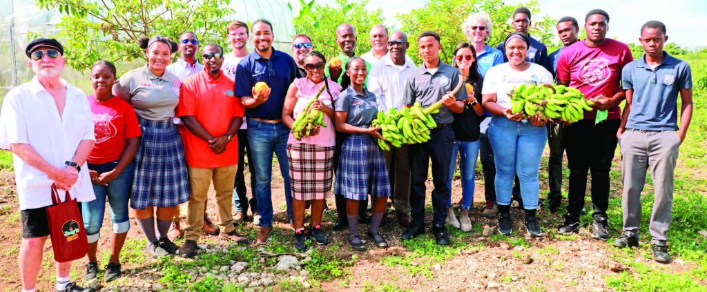 PHAHS Principal Kenneth Roberts (center) stands with students, and teachers, along with guests from Disney Cruise Line, One Eleuthera Foundation/Center for Training and Innovation, and the Agricultural Development Organization during the kickoff of the Micro Garden and School Farming Project at the school.