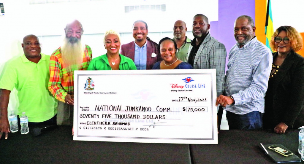 Bahamas National Junkanoo Committee members and Ministry of Youth, Sport & Culture representatives, stand with DCL Regional Public Affairs Director, Joey Gaskins (center), along with local Eleuthera officials.