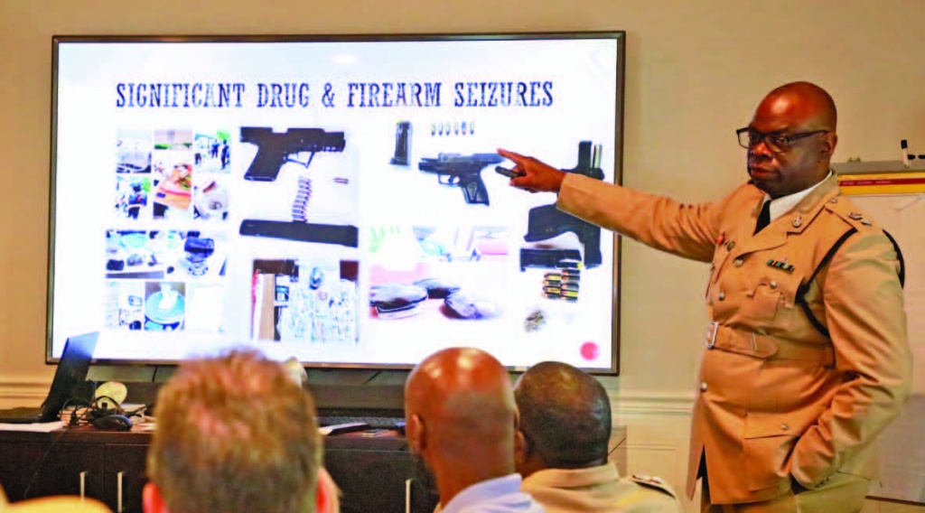  Superintendent Franklyn Neely, points to a slide with images of Firearms and Drugs that had been seized by the Royal Bahamas Police Force in Eleuthera and Harbour Island in multiple operations during the past 24 months.