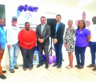 Pictured above; MP Minister Clay Sweeting (center) stands with local government officials and members of the Digital Transformation Unit during MyGateway training sessions.