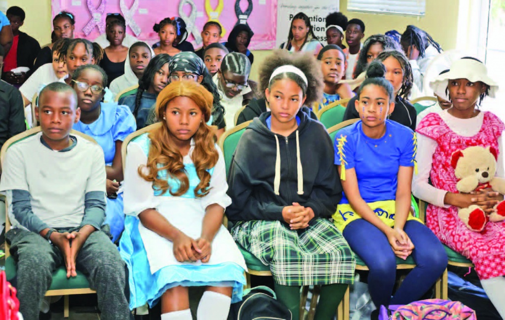 Central Eleuthera students look on, as their peers perform during the national arts festival.