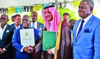 Prime Minister and Minister of Finance, the Hon. Philip Davis (center left), exchanges a handshake with His
Excellency Sultan Abdulrahman Al-marshad, Chief Executive officer, Saudi Fund for Development (center right), during
the signing ceremony for a $55 million loan agreement. Also seen is Deputy Prime Minister and Minister of tourism, Investments and Aviation, the Hon. Chester Cooper (end left), and Paul Bevans, Chairman, Airport Authority (end right).