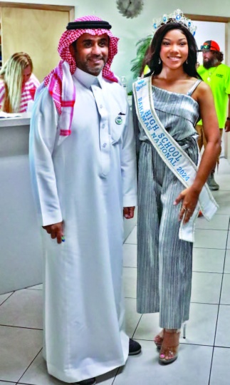 Kaynia minnis from the north Eleuthera High school, inaugural winner of the Bahamas National High School Pageant in March 2024, stands with a delegate from the Saudi Fund for Development.