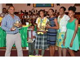 Honour Roll student of CEHS, Valedictorian of the  Class of 2016 & Head Girl, Safyha Bryan, surrounded by her family and the District Supt. Helen Simmons-Johnson - 490A7081