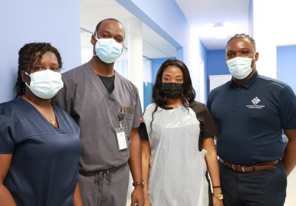Above: Dr. Arlington Lightbourne (center left) stands with members of his medical services team at the Bahamas Wellness Eleuthera Medical Center.