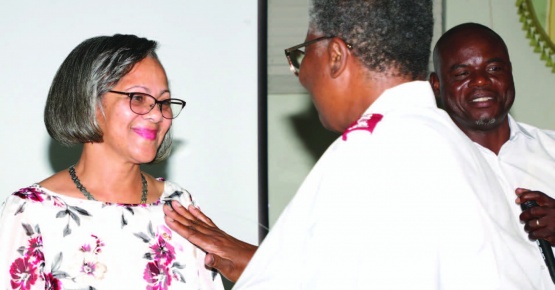 Above: Local Salvation Army leader, Major Hepburn, invited as quiest speaker for the September 10th ECS board installation, is pictured pinning new president, Ms. Susan Culmer.