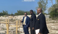 CSE MP the Hon. Clay Sweeting stands with the Hon. Zane Lightbourne and Hon. Vaughn P. Miller, as they view the start of construction on homes within the Ministry of Housing and Transport's new Ocean Hole Subdivision in Rock Sound, South Eleuthera, early in December 2022.